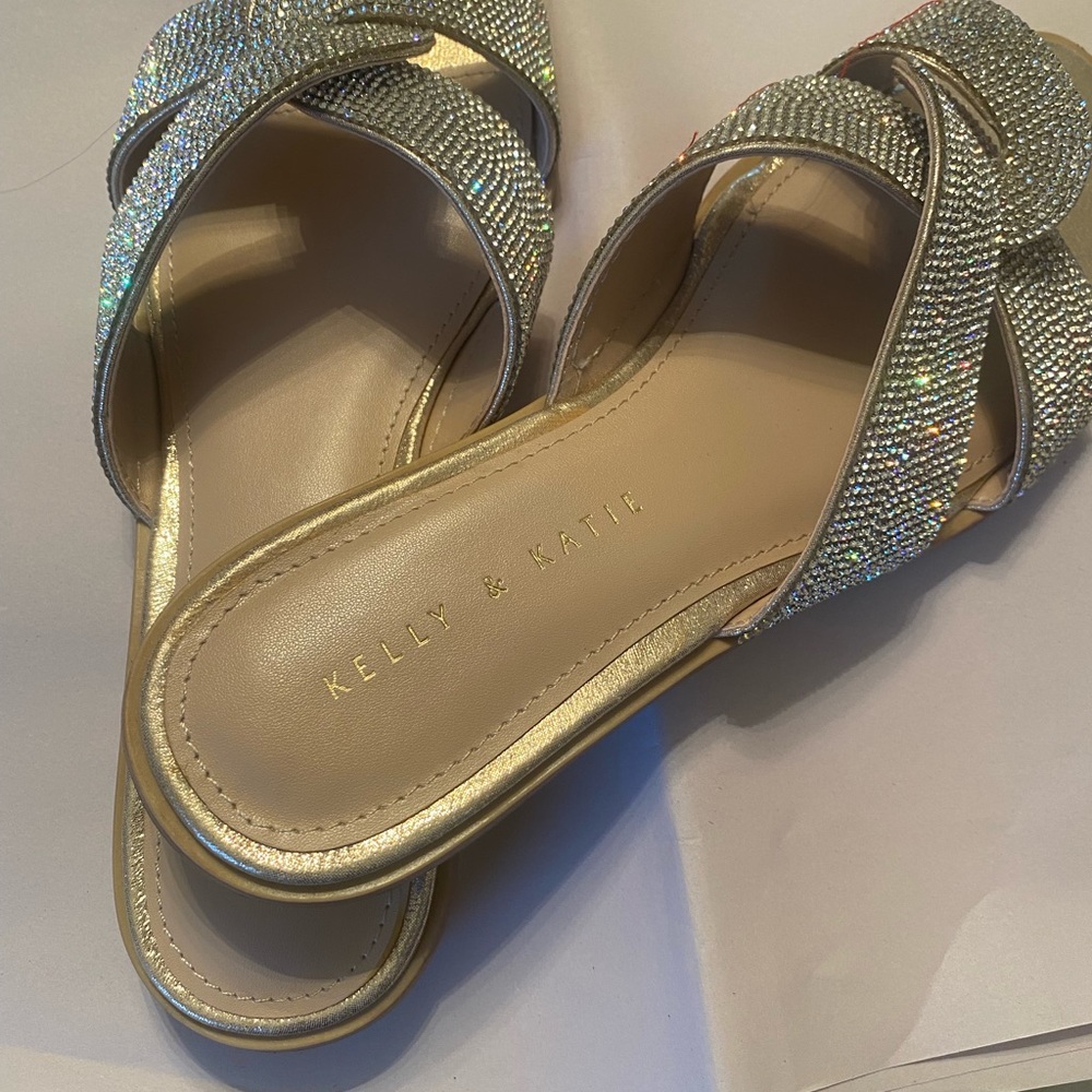 New sandal .never worn. Silver rhinestones on streps.